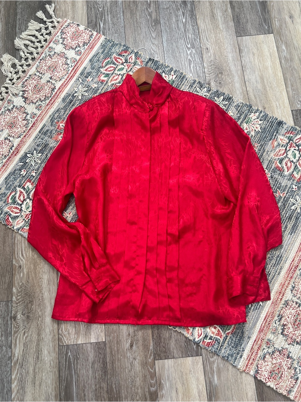 Worthington vintage red long-sleeve blouse featuring a high mock neck and a plea